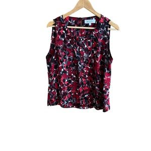 Kasper woman’s sleeveless dotted red and black pleated blouse. Size PXL.